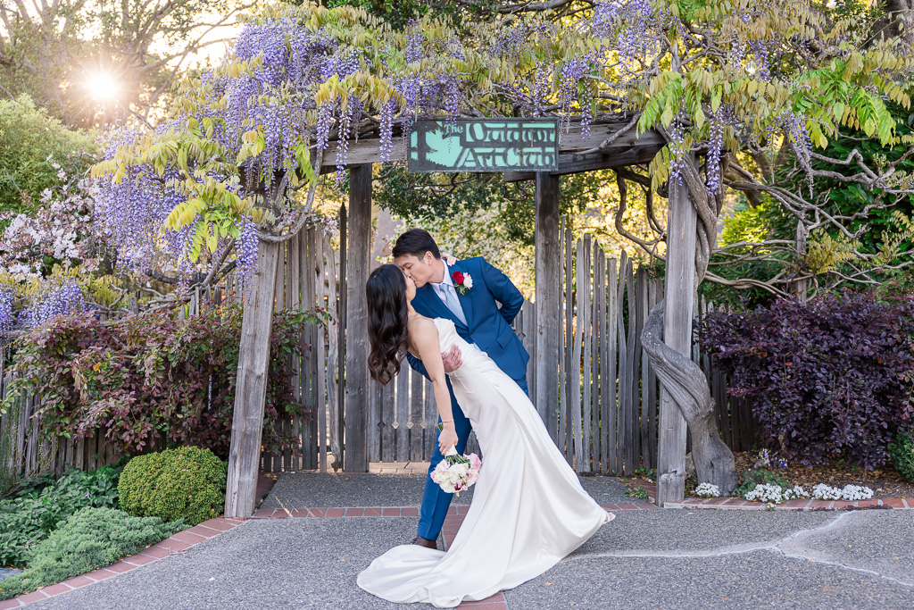 a dip and kiss in front of the Outdoor Art Club entrance