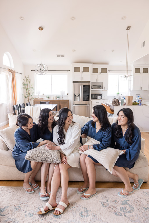 bride and bridesmaids on a sofa