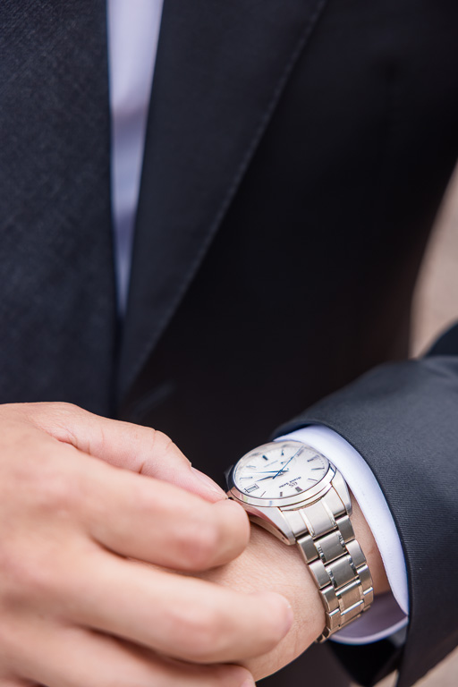 photo of groom's details, adjusting watch