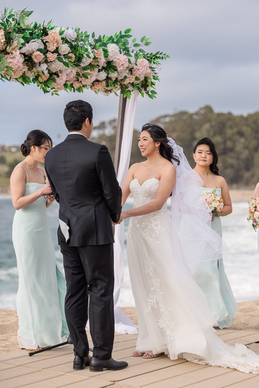 bride during ceremony on the beach