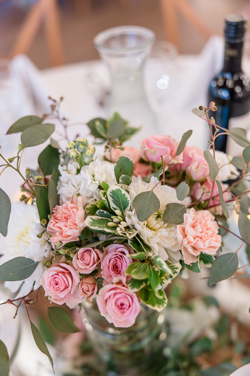 floral decor on reception tables at Carmel Fields