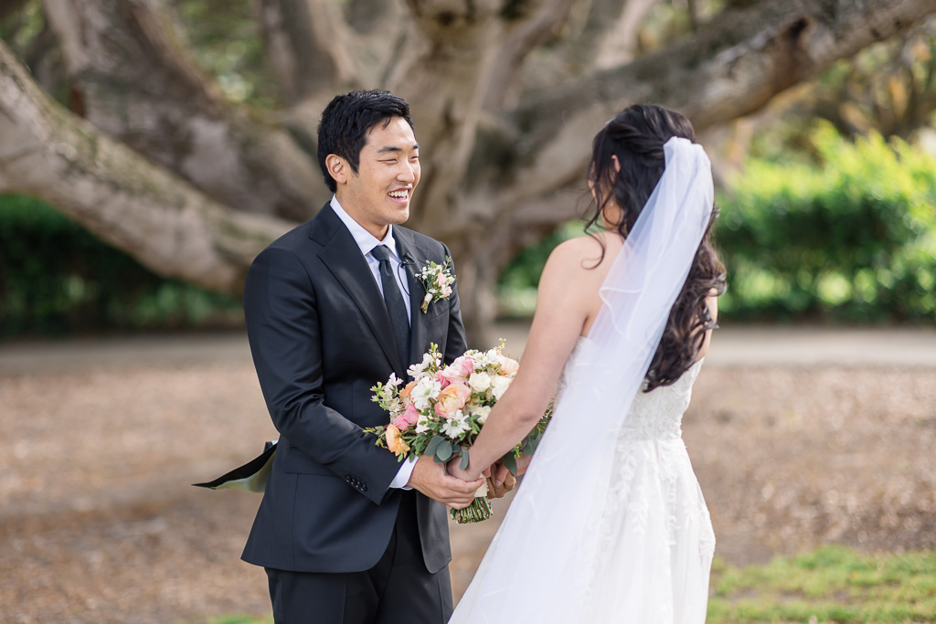 a very happy wedding first look
