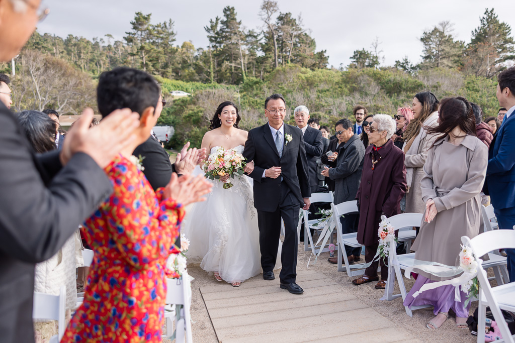 bride and dad walking up the aisle at Monastery Beach