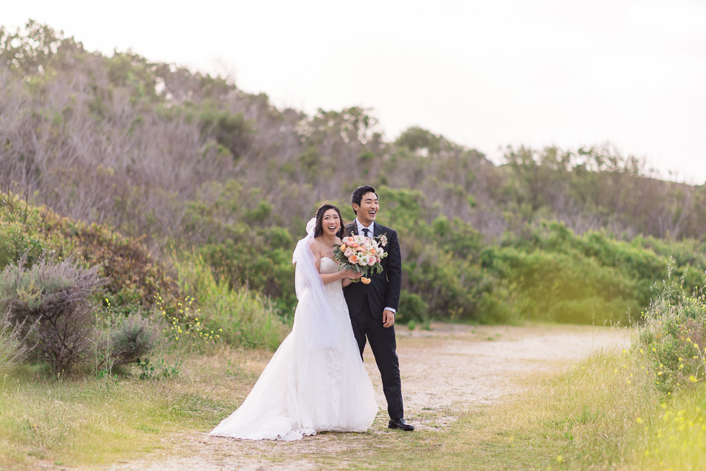 candid photo of bride and groom on a trail