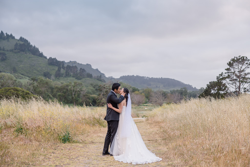 wedding pic on a grassy trail