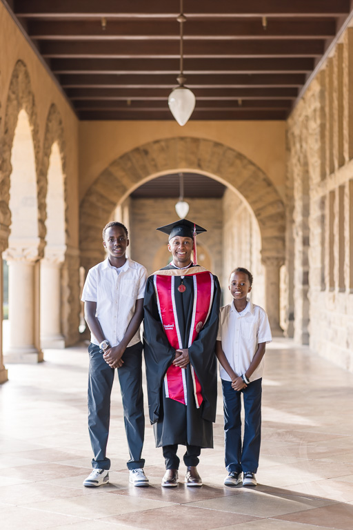 Stanford arch walkway graduation photo with family