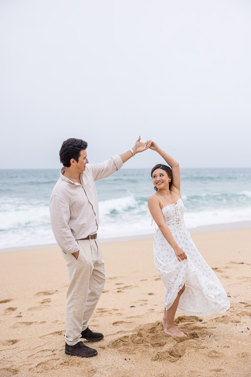 dancing at Montara State Beach in a white dress