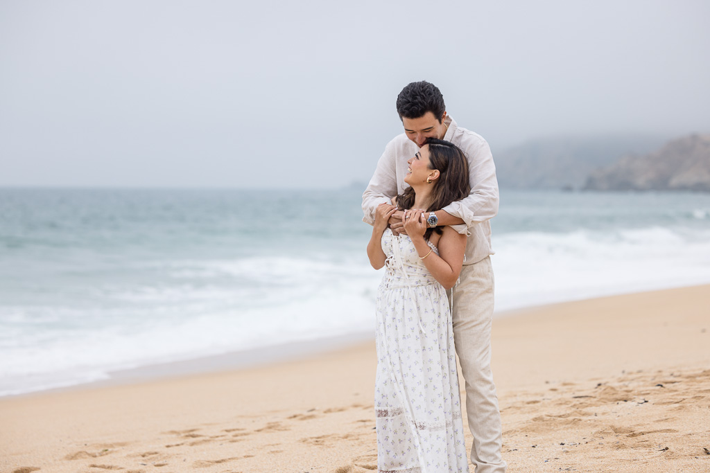 engagement photo at a foggy Montara State Beach