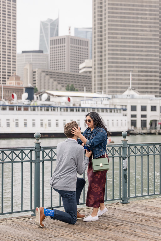 an emotional photo of couple getting engaged at the Embarcadero