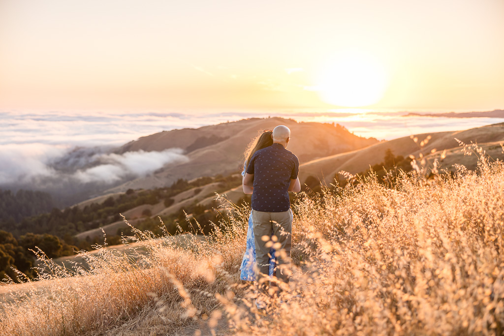 couple admiring the fog rolling in over the Santa Cruz Mountains at sunset