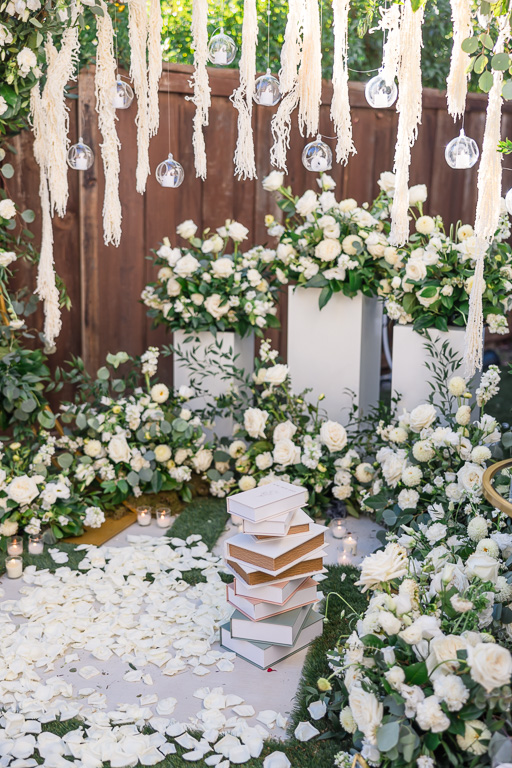 books and floral arrangement for marriage proposal
