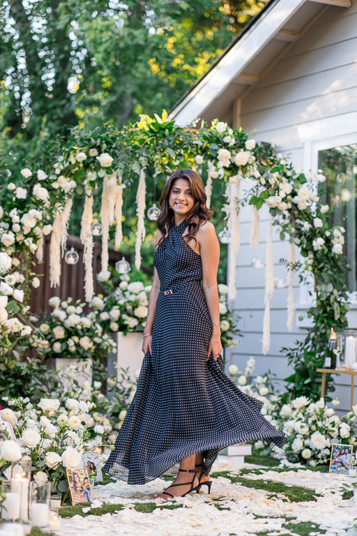 twirling black polka dot dress