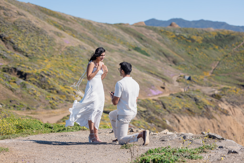 tearful emotional reaction to surprise proposal on cliff top