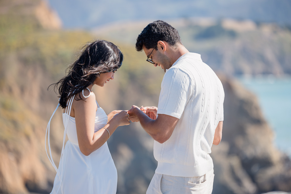 putting on the engagement ring after proposal