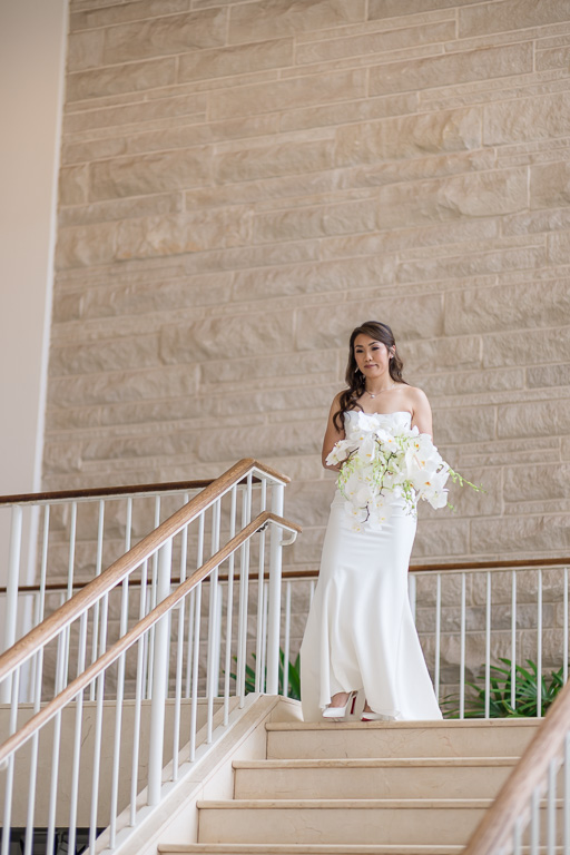 bride walking down stairs for first look