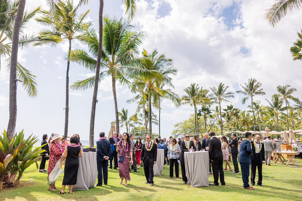 guests gathering and mingling under the Hawaiian sun