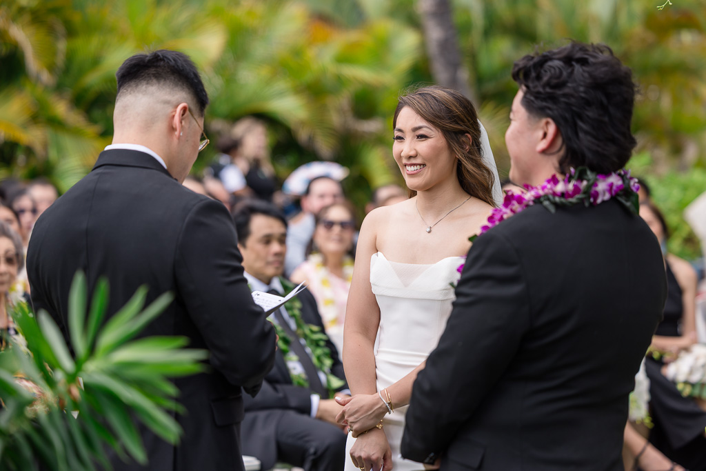 groom reading his vows to his bride