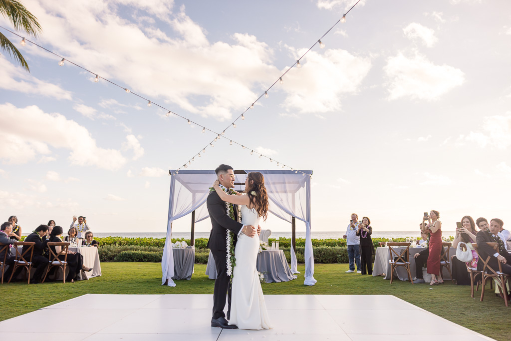 bride and groom first dance on dance floor