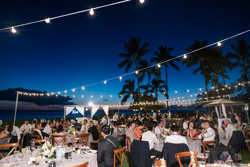 nighttime wedding reception with string lights