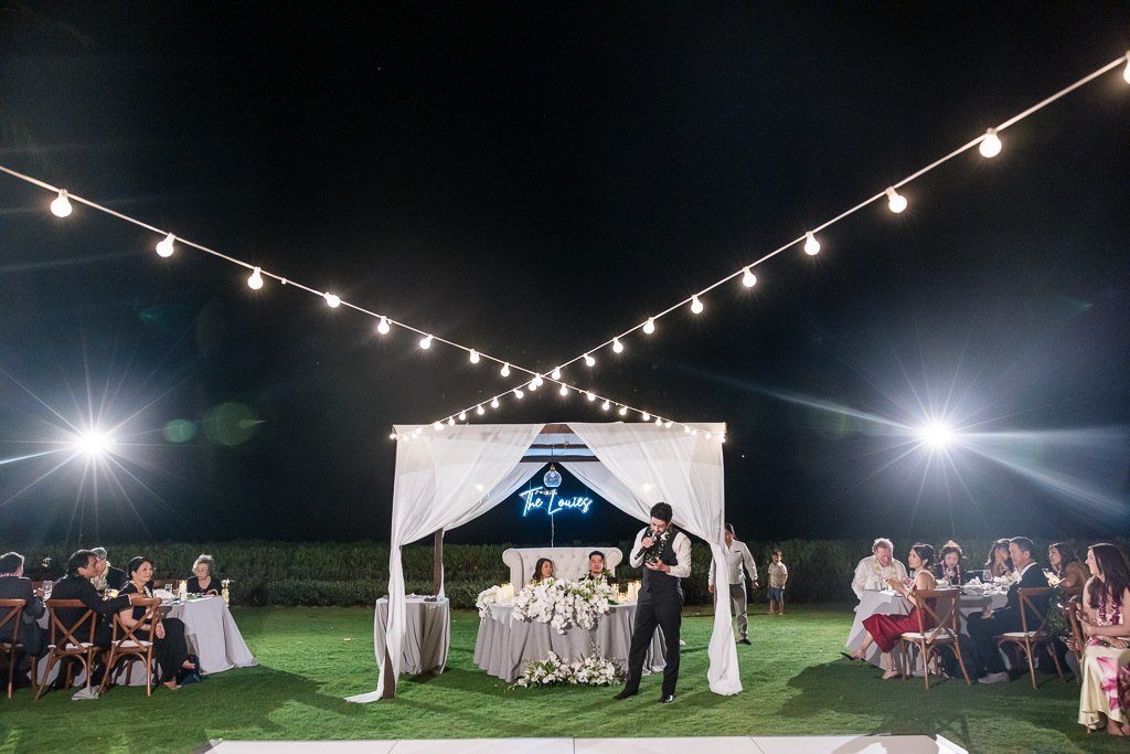 groomsman giving a toast to the bride and groom
