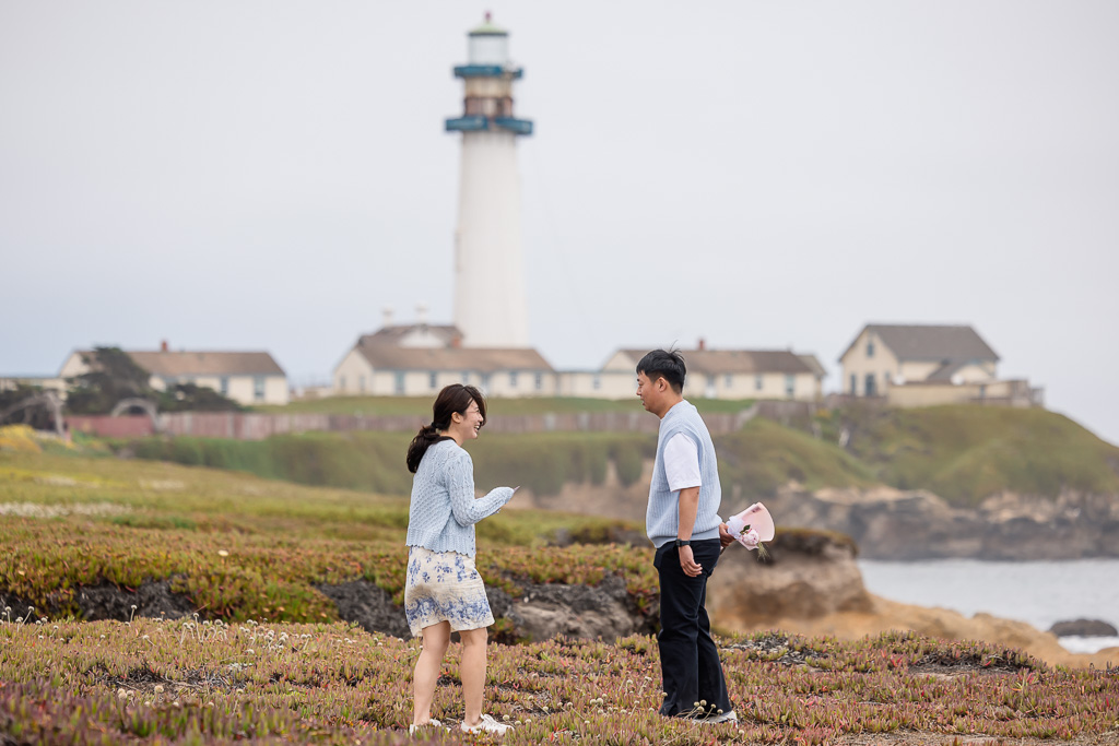 hiding a bouquet behind his back for a surprise proposal