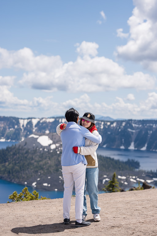 couple hugging atop Crater Lake