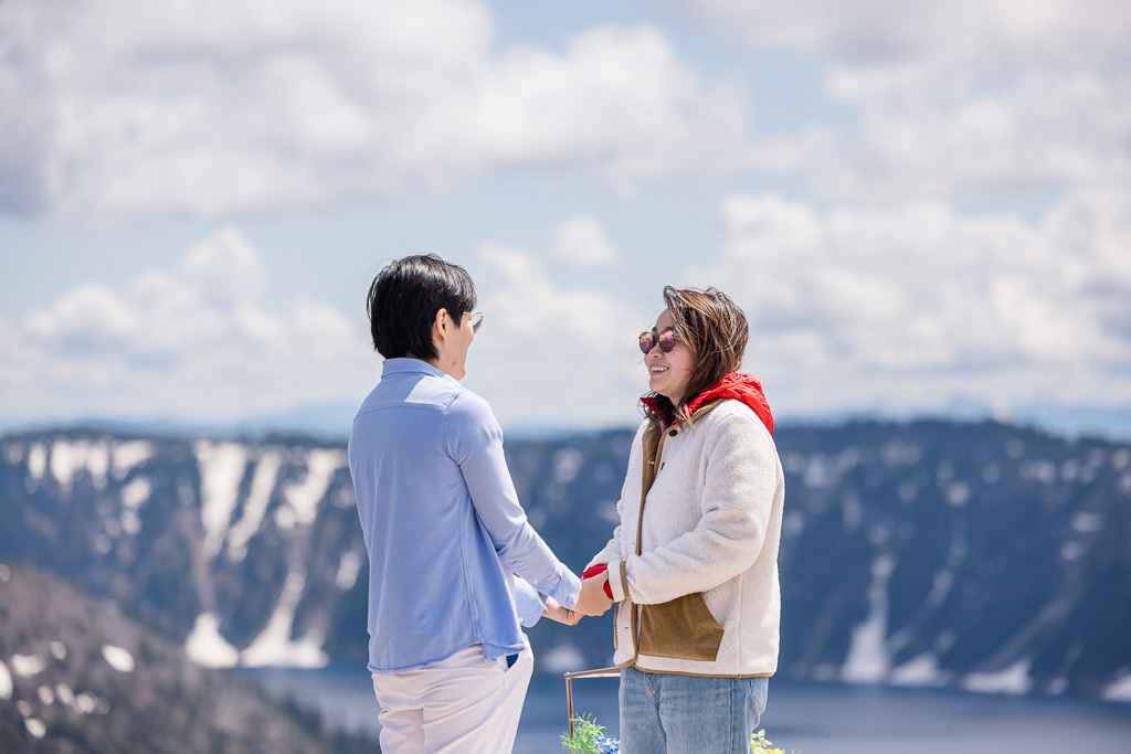 giving proposal speech in front of snow-capped mountains