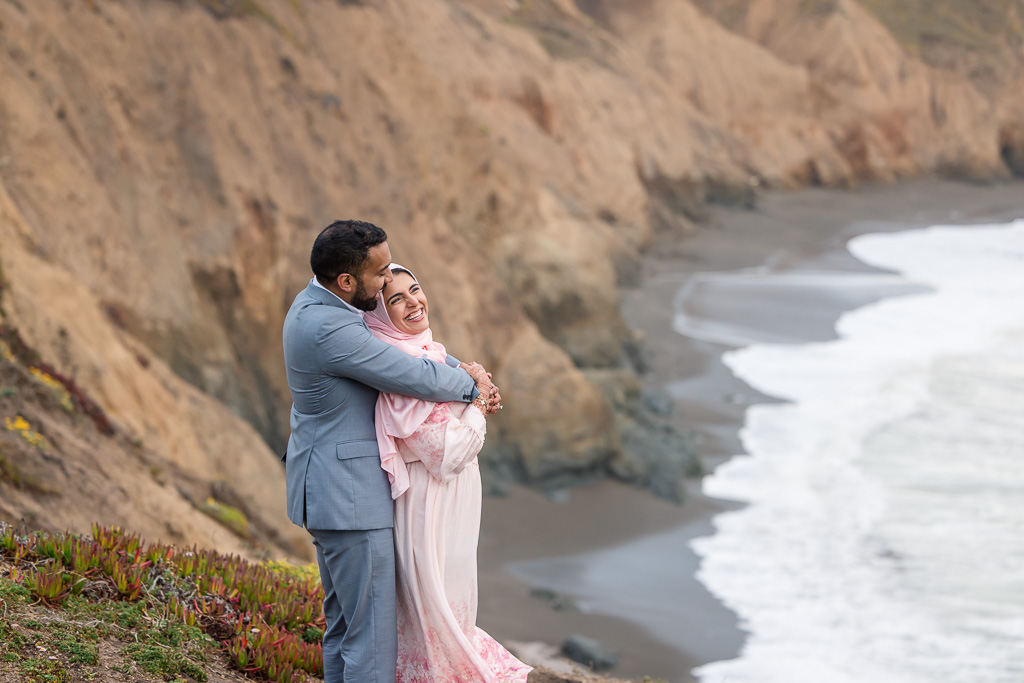 Pacific coastline engagement photos with hijab