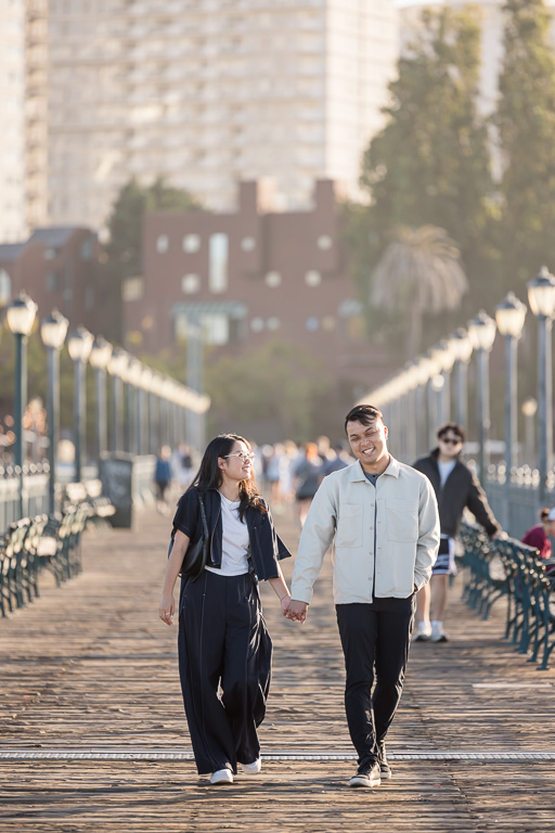 couple walking down Pier 7