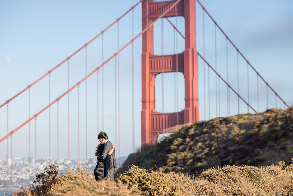 creative paparazzi-style portrait of couple at the Golden Gate Bridge