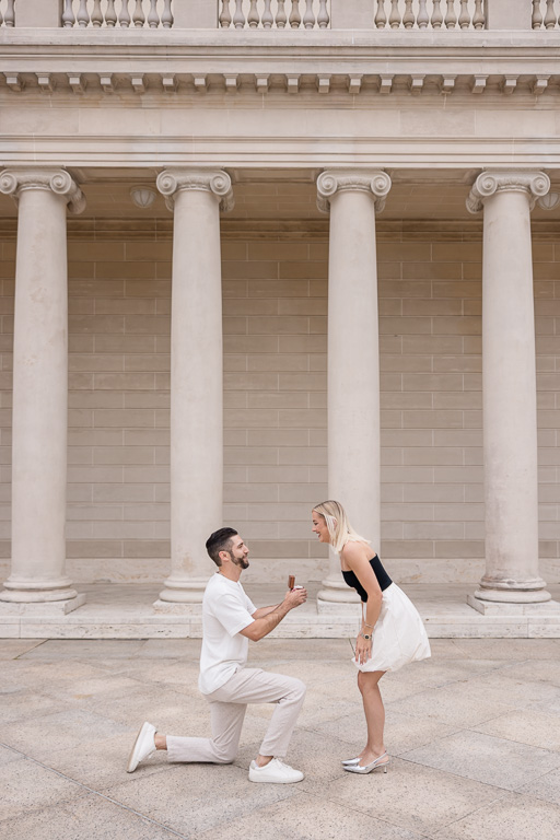 marriage proposal with white marble columns backdrop