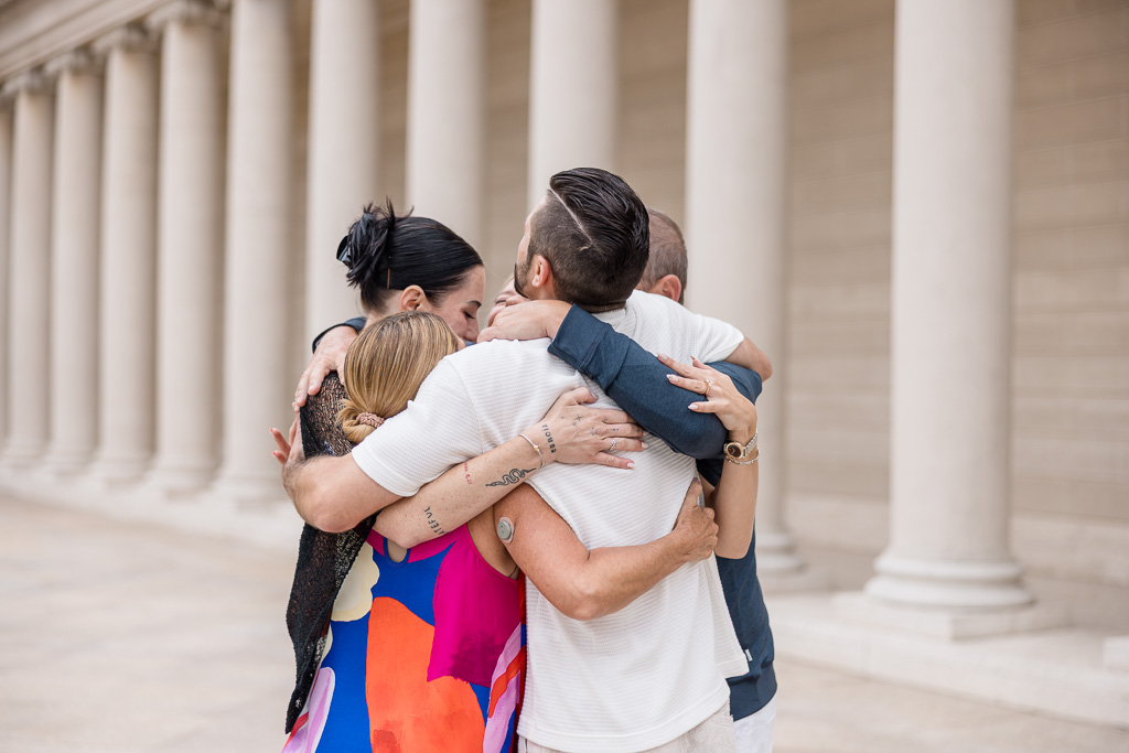 group hug with friends after engagement