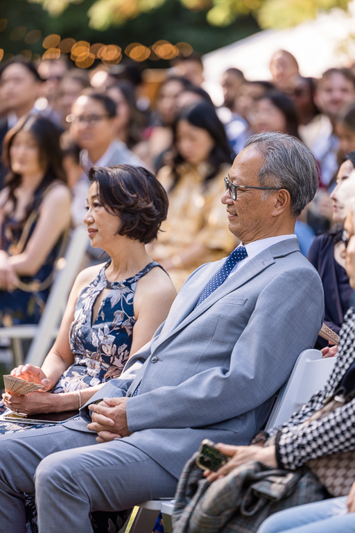 parents seated at wedding ceremony