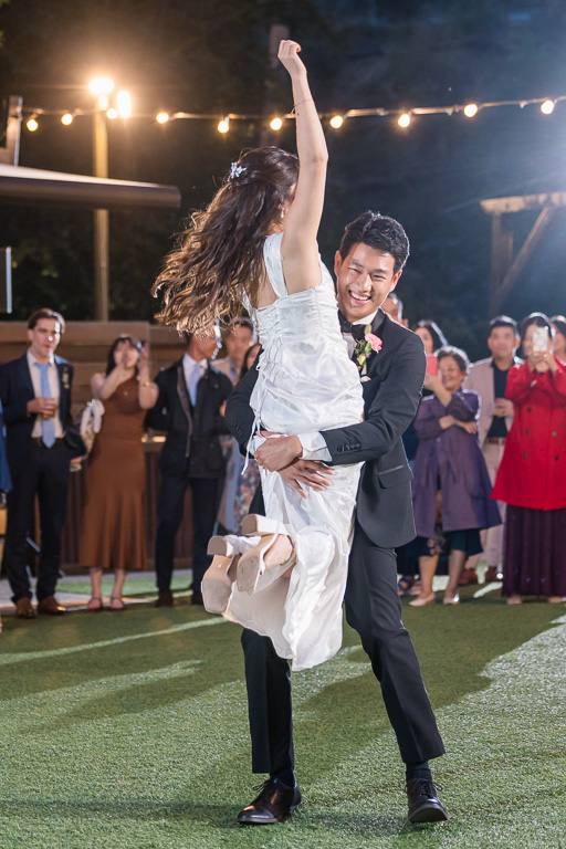 groom lifting up the bride at the end of the first look