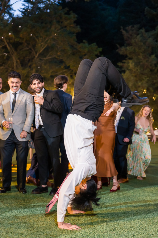 someone doing a flip on the grass