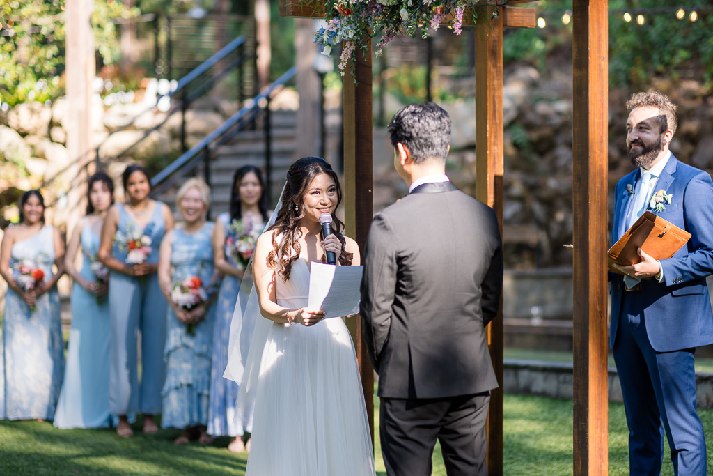 bride saying her vows to her groom