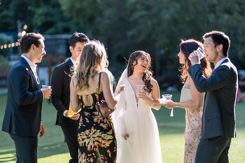 bride mingling with guests at cocktail hour