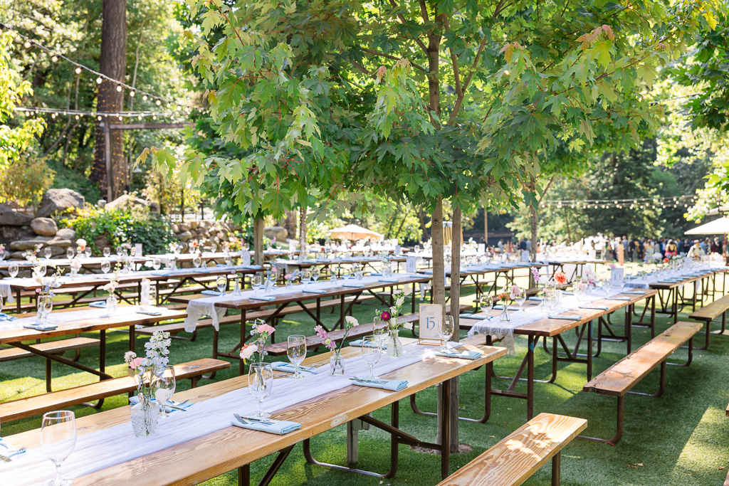 long wooden reception tables at Saratoga Springs Longbridge area