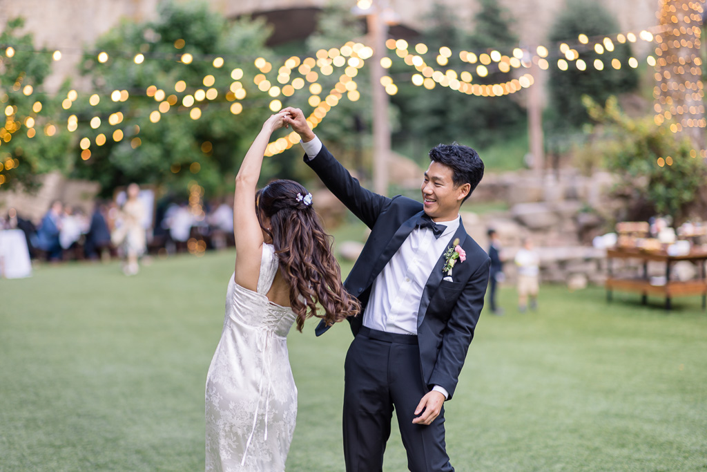 bride and groom doing a little spontaneous twirl