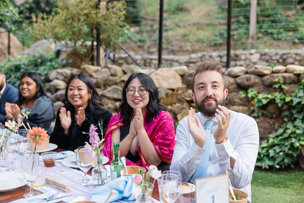 guests clapping for dinner toasts