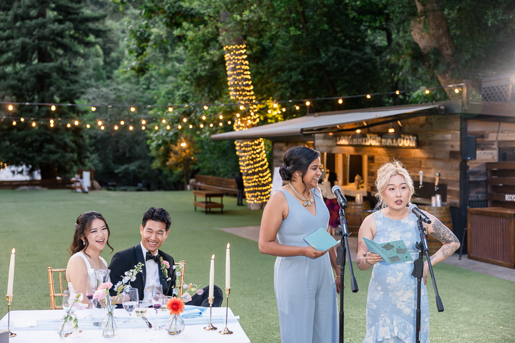 bride and groom laughing at bridesmaids speeches