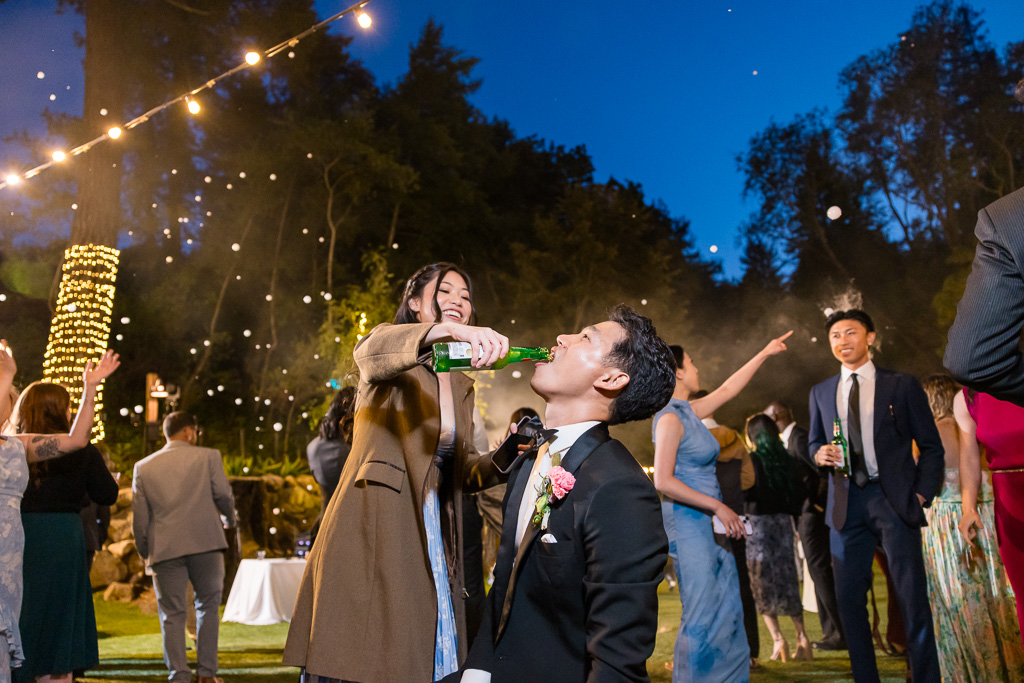 groom chugging a bottle
