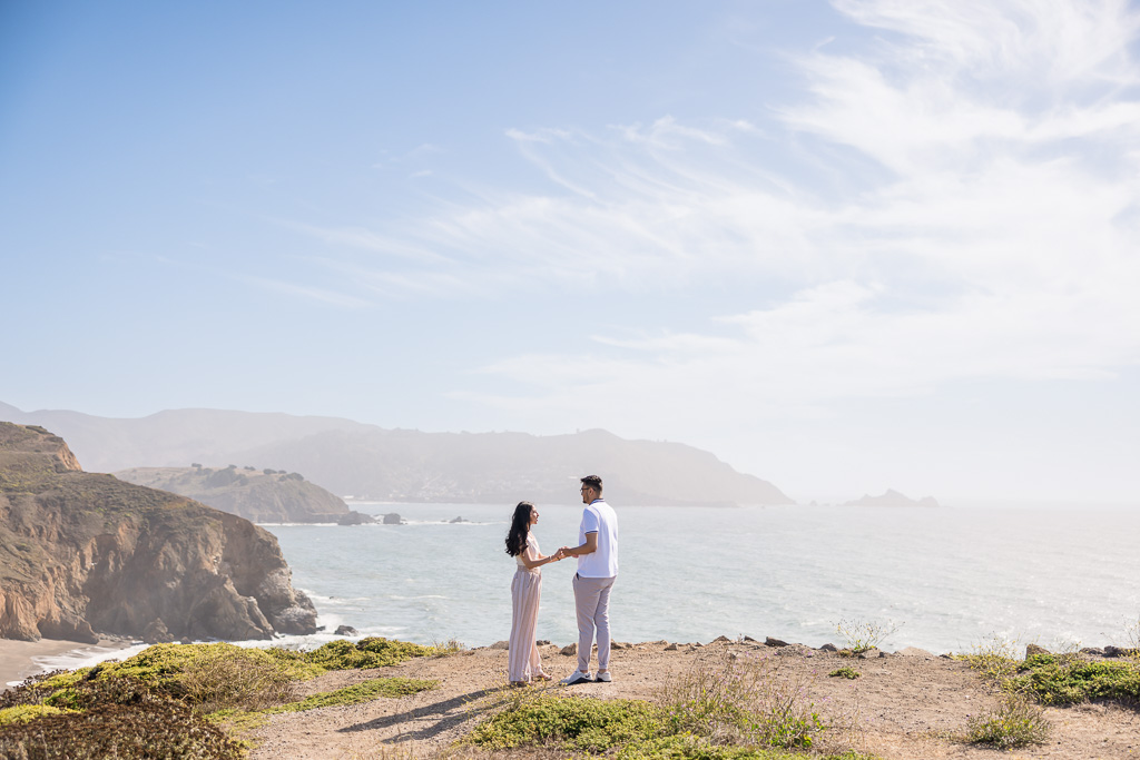 couple standing at the top of Mori Point in Pacifica