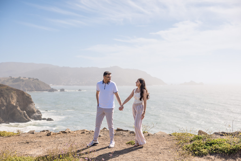 couple walking along the cliffs of Pacifica