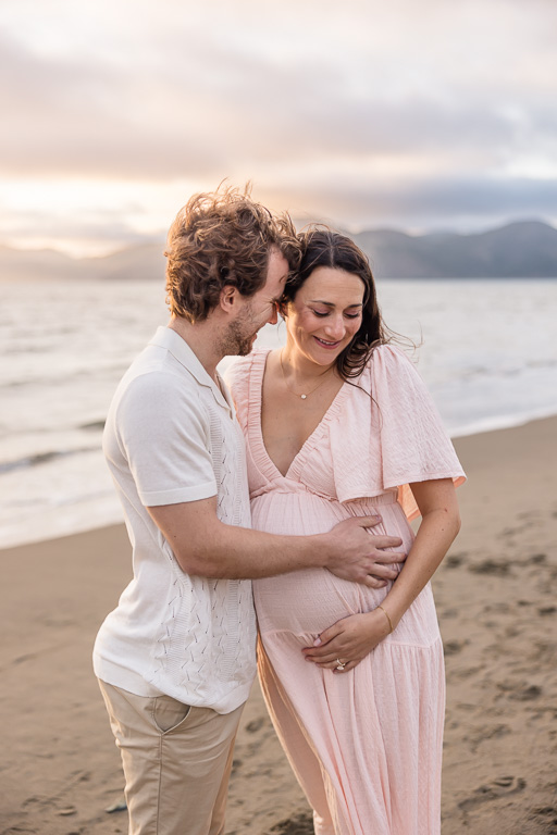 sunset maternity photos in pastel colored dress