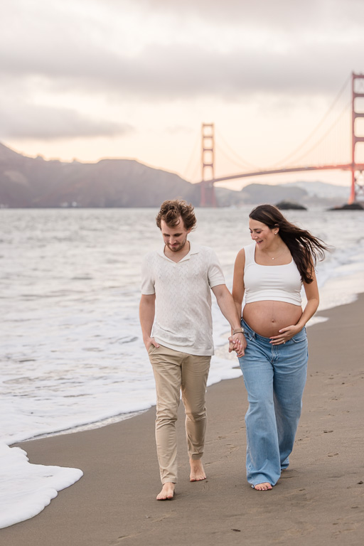 maternity photo shoot at the beach with the Golden Gate Bridge
