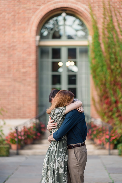 a mid photo shoot genuine hug