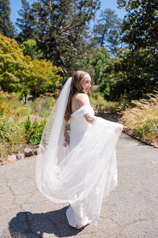 candid solo shot of bride with her full dress and veil