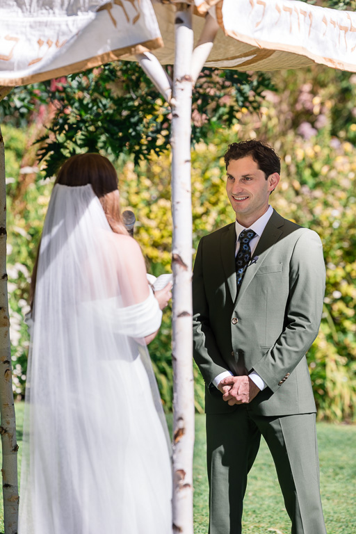 groom angle during ceremony vow exchange