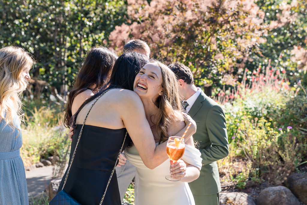 bride and groom mingling with guests at outdoor cocktail hour